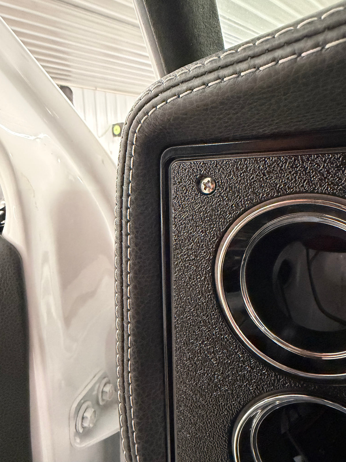 Close-up of leather wrapped dash stitching on a square body truck