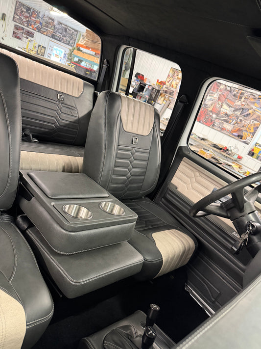 Legacy Series TriMax bucket seats in black and cream with hex stitching, crew cab square body interior
