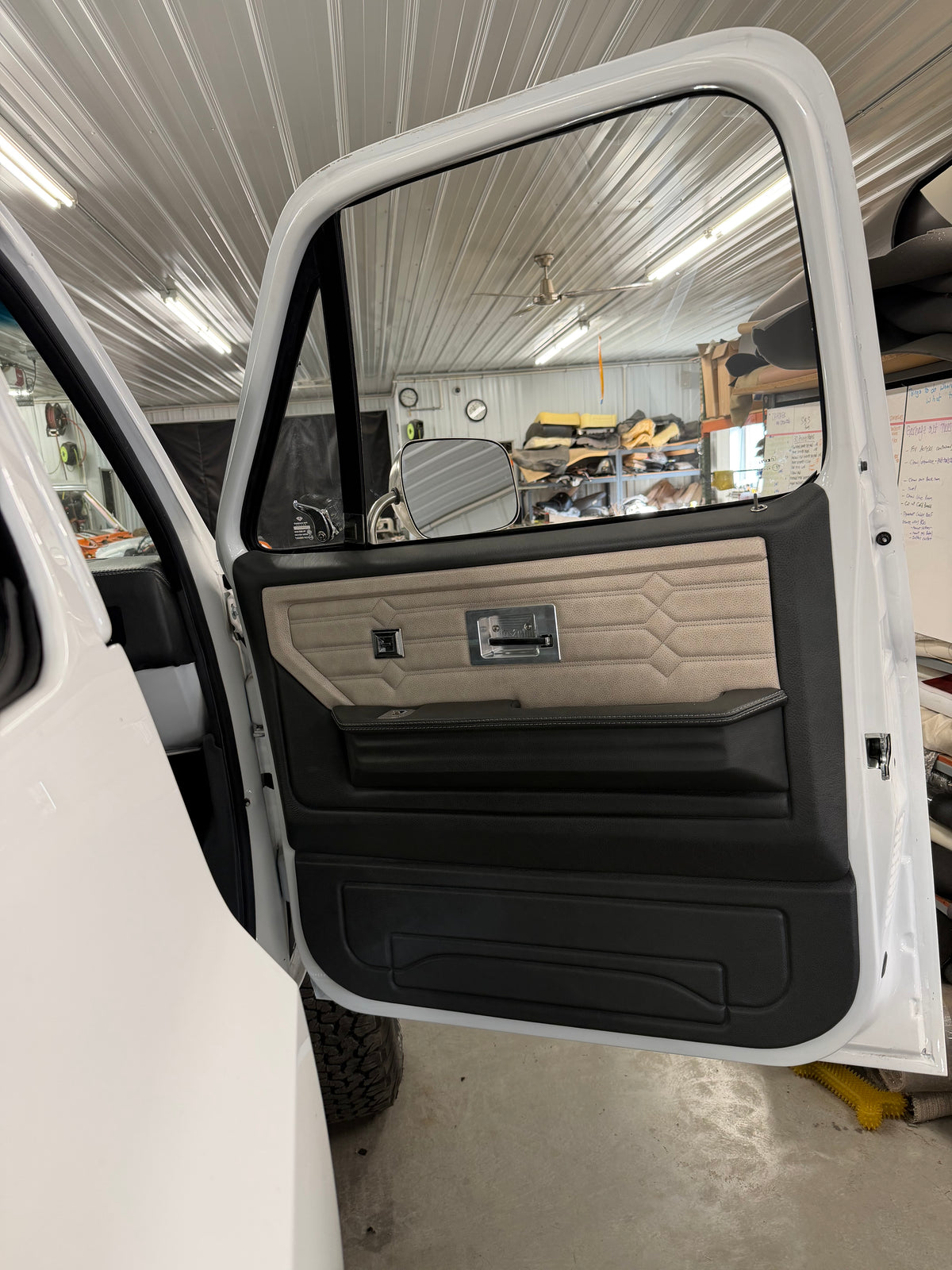 Legacy Series rear door panel in black with cream hex-stitched insert, crew cab