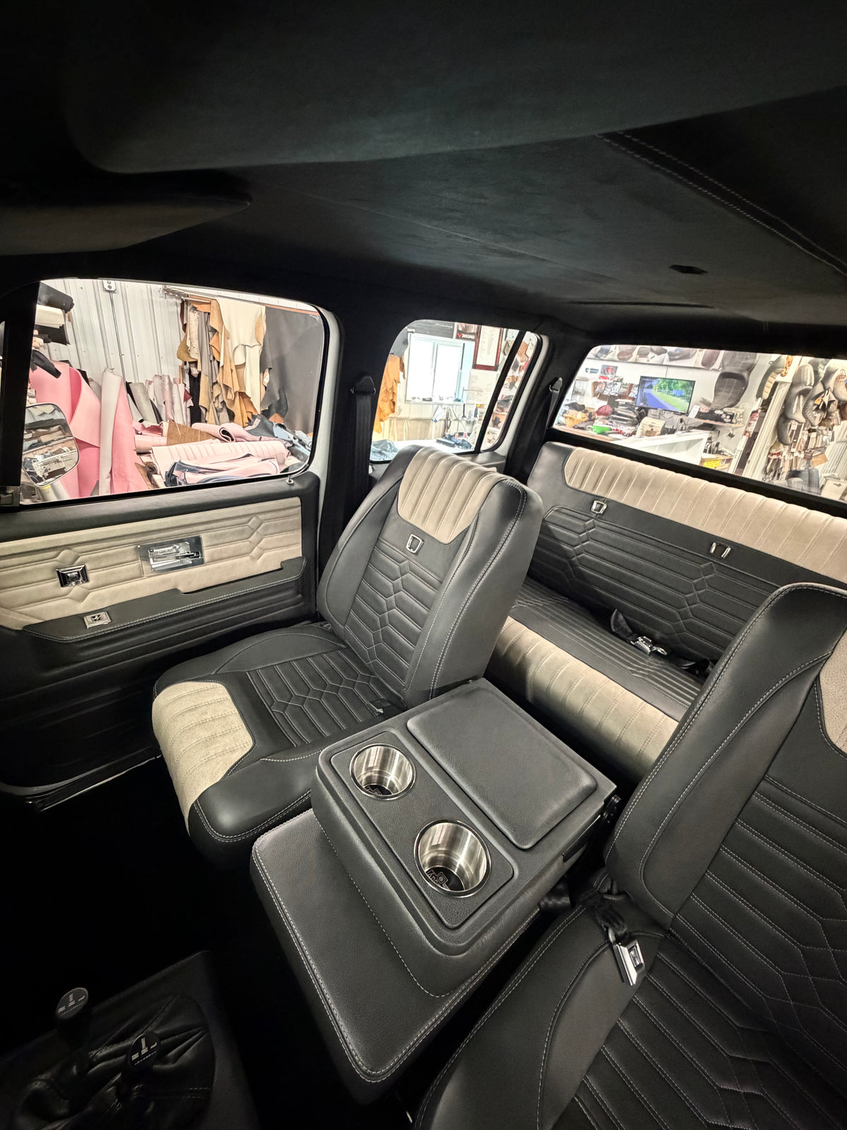 Legacy Series TriMax seats with center seat and cup holders in black and cream