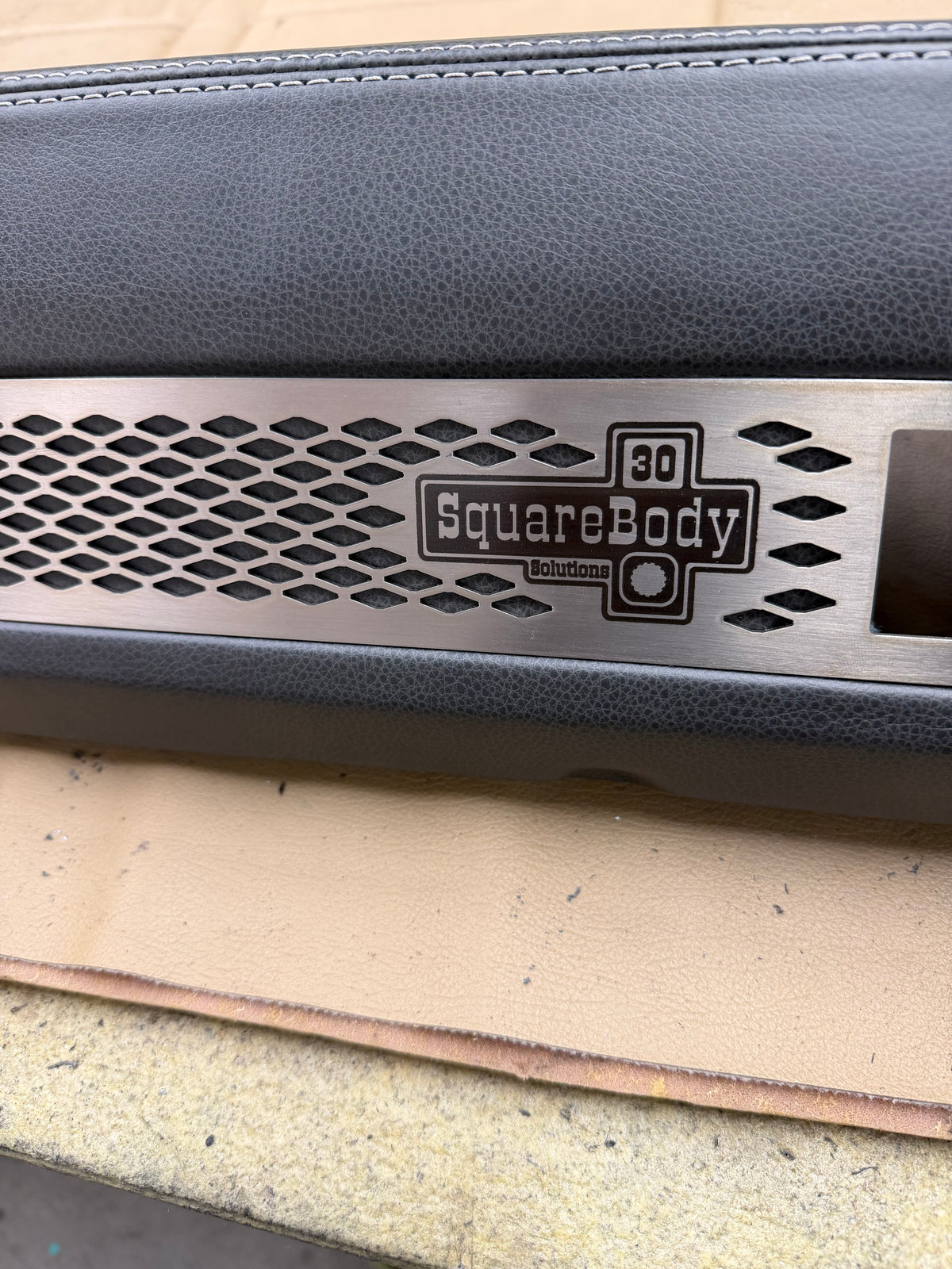 Stainless SquareBody Solutions dash bezel on leather wrapped dash