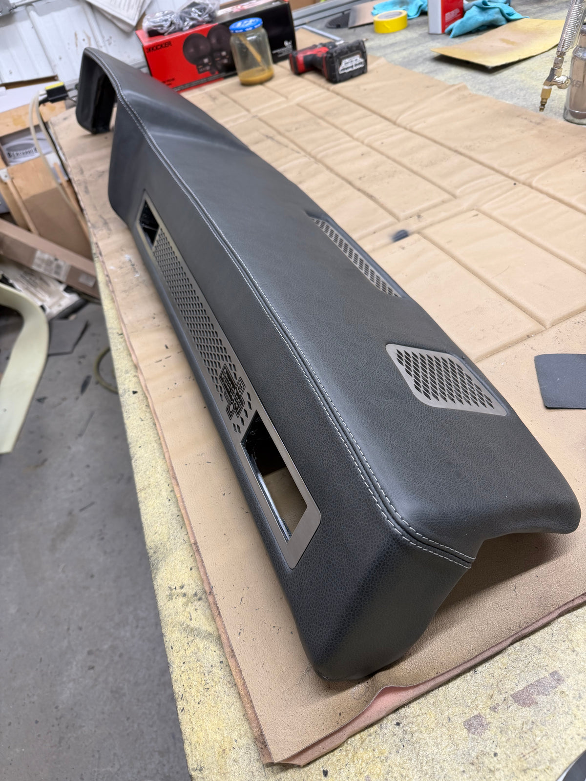 Leather wrapped square body dash with stainless grilles and white stitching