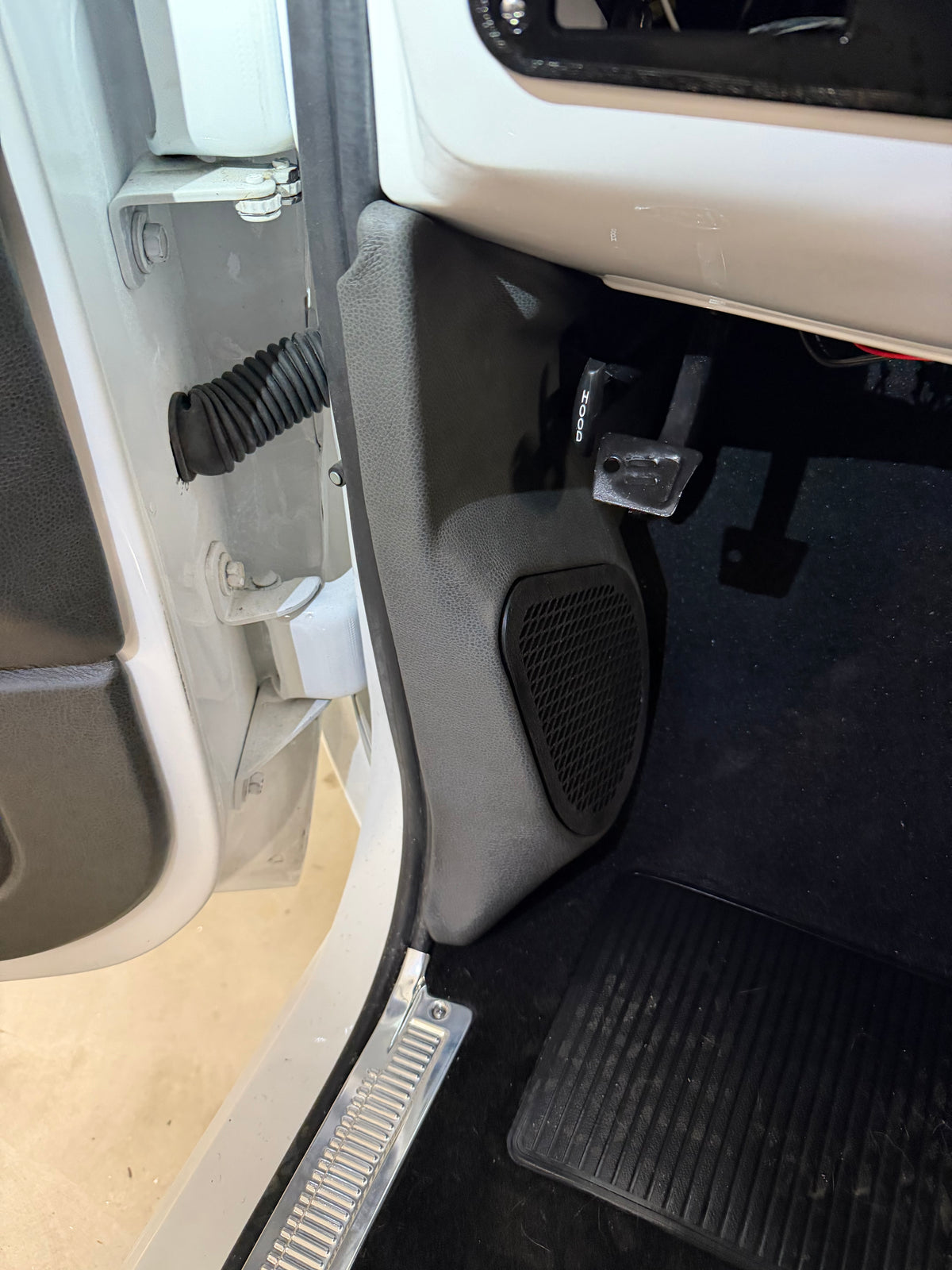 Custom kick panel installed in a square body truck