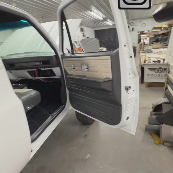 Leather wrapped square body dash with stainless grilles and SquareBody Solutions bezel