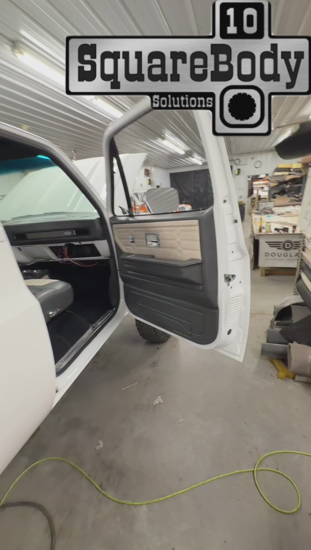 Leather wrapped square body dash with stainless grilles and SquareBody Solutions bezel